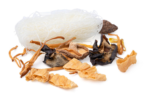Isolated food dry chinese.  Chinese herbs and flat lay composition. Variety of dried mushroom, dried medicine herbal, noodle,  black tea and fruit tea. - 写真・画像