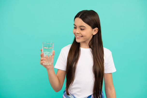 smiling girl going to drink beverage. healthy childhood lifestyle. water balance in body. - Photo, Image
