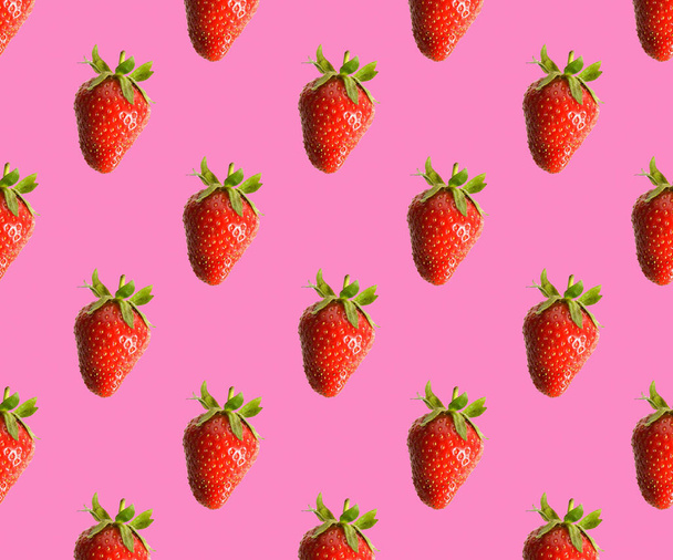 Strawberries on a pink background. Strawberry slices - Photo, image