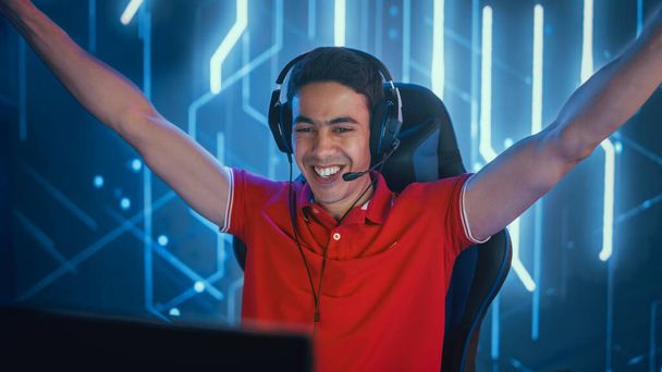 Professional eSports Gamer Playing in Computer Video Games, Happily and Cheerfully Celebrates Victory and Success. Online Championship Tournament. Portrait Front View Shot - Foto, imagen