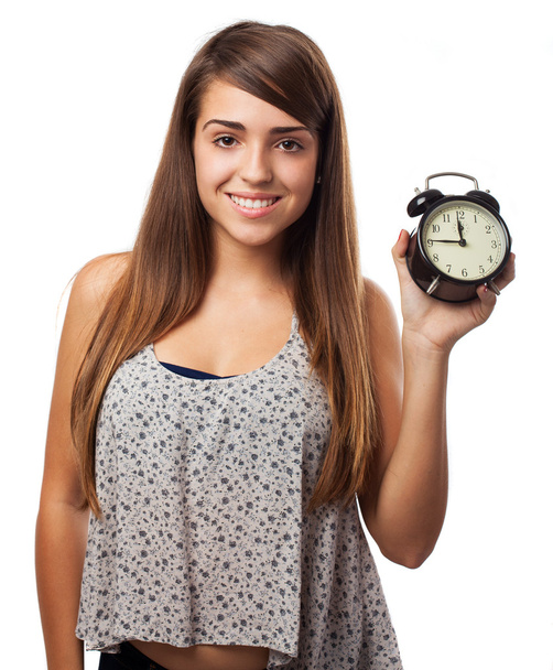 Young woman holding alarm clock - Fotoğraf, Görsel