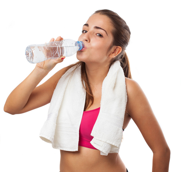 Sporty woman drinking water - Fotoğraf, Görsel