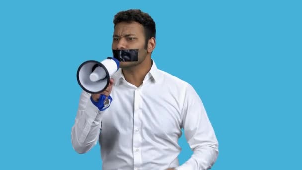 Man with taped mouth unable to speak out. - Imágenes, Vídeo