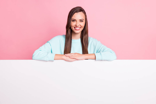 Photo of friendly lady toothy smile folded hands wear light blue pullover isolated on pink color background - Photo, image