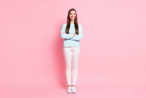 Full size photo of cheerful charming girl lovely smile crossed hands isolated on pastel pink color background - Photo, Image