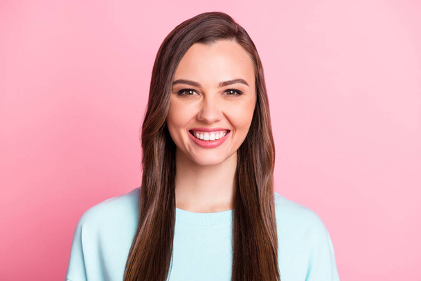 Photo of cheerful attractive young woman beaming smile long hair isolated on pastel pink color background - Foto, Imagen