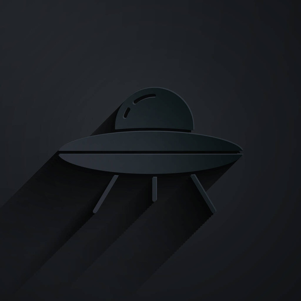 Paper cut UFO flying spaceship icon isolated on black background. Flying saucer. Alien space ship. Futuristic unknown flying object. Paper art style. Vector. - Vector, Image