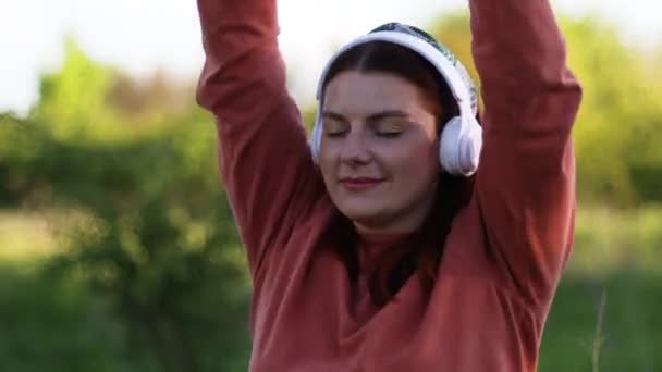 Active woman listen music dancing, enjoy funny playtime on weekend - Filmati, video