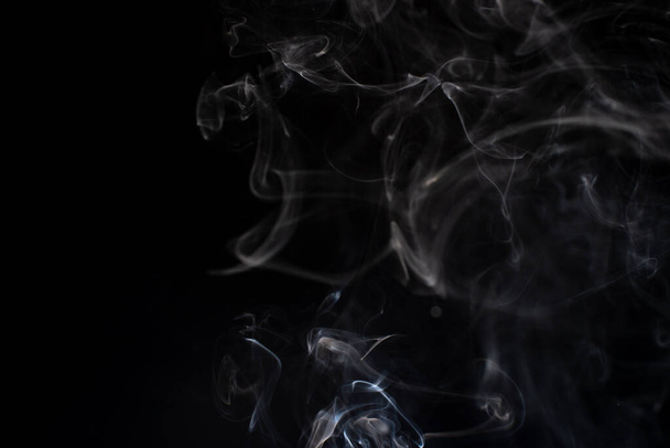 cloud of white smoke on black background - 写真・画像