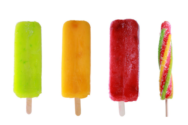 Four delicious frozen Popsicles isolated on white - Foto, imagen