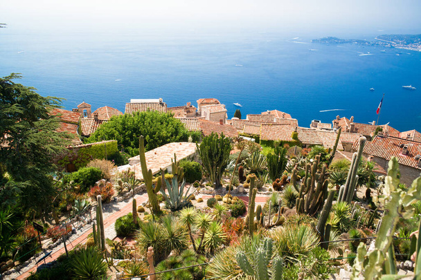 Aerial view on "Eze" city terracotta rooftops and blue mediterranean sea. Eze, French Riviera, France. - Foto, afbeelding