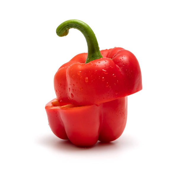 Red bell pepper cut in half isolated on a white background - Foto, immagini