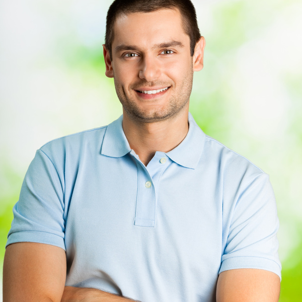 Portrait of happy young man, outdoors - Photo, Image