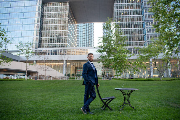 Manager in a luxury modern open space business center. Successful business man outside. - Foto, afbeelding