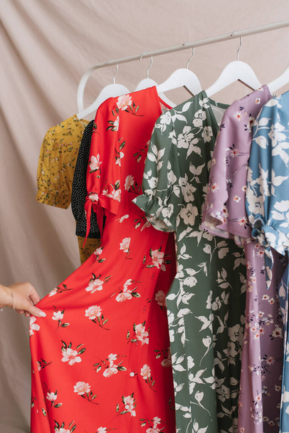 summer dresses with floral print on a hanger assortment - Valokuva, kuva