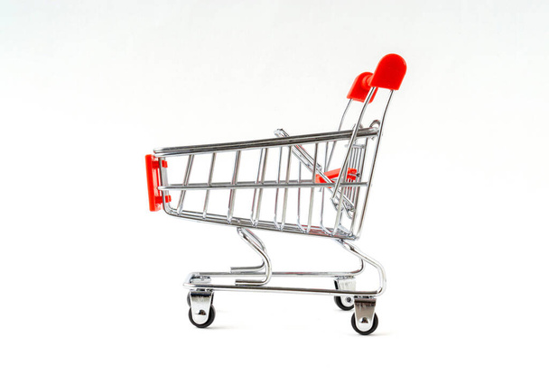 Supermarket shopping cart isolated on white background. - Photo, Image