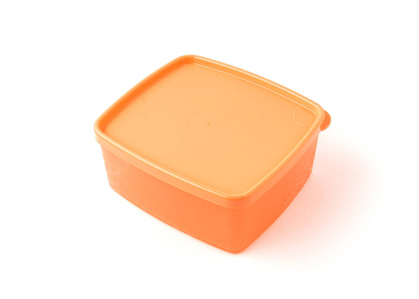 Orange plastic container isolated on white background. - Valokuva, kuva