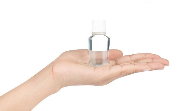 hand holding mini water mouthwash isolate on white background - Zdjęcie, obraz