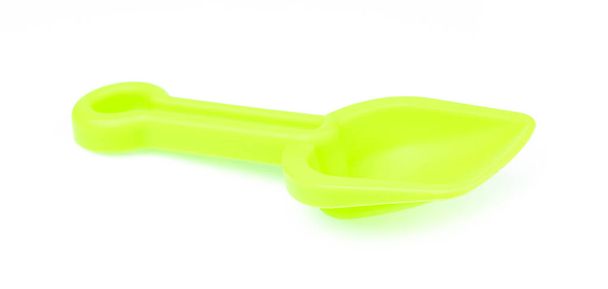 Small plastic toy shovel isolated on a white background. - Photo, Image