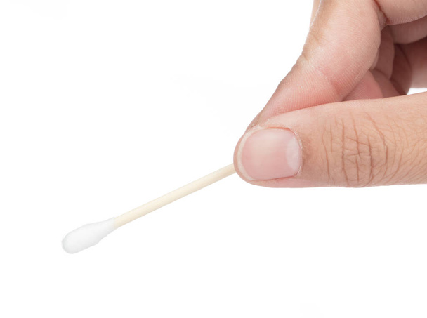 Hand holding Wooden cotton swabs isolated on a white background. - Photo, Image