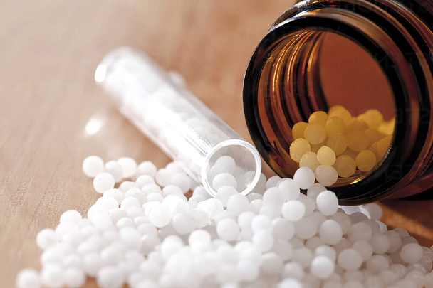 Homeopathic pills in a jar, close up - Fotoğraf, Görsel