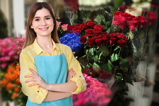 Beautiful female florist in shop, space for text - Foto, Imagem