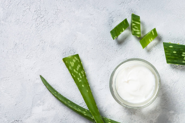 Aloe vera cosmetic at stone table top view. - Foto, afbeelding