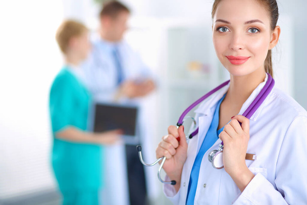Woman doctor standing at hospital - Foto, Imagen