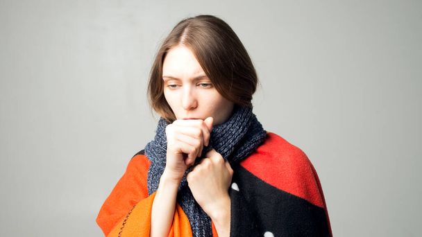 Ill young woman feeling cold having flu grippe symptoms covered with blanket, sick teen girl shivering freezing at home wrapped with plaid, no heating problem and fever temperature flue concept - Photo, Image