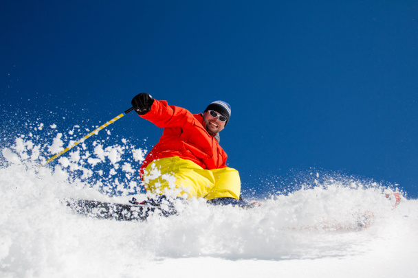 Ski, Skier, Freeride in fresh powder snow - man skiing downhill - Photo, Image