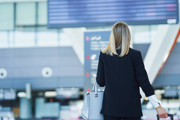 Adult female passenger at the airport - Fotoğraf, Görsel