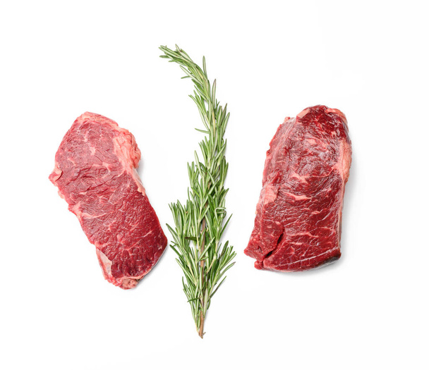 nyers marha steak fehér alapon, klasszikus hátszín barbecue, felülnézet - Fotó, kép