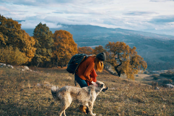 woman tourist next to dog and walk friendship journey - 写真・画像