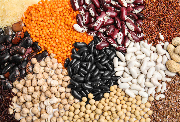 Various raw veggie seeds as background, top view - Foto, Imagen