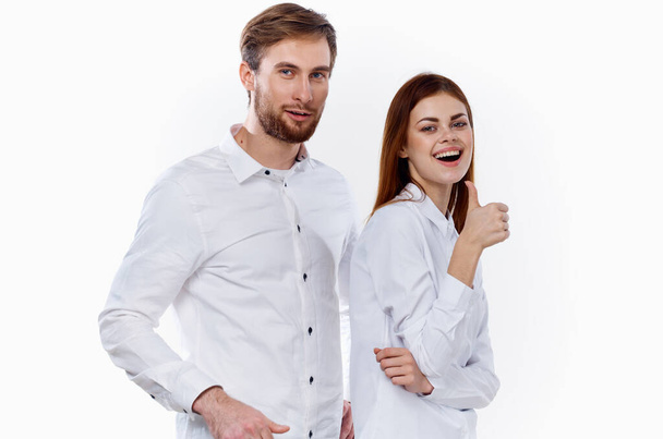 cheerful employees gesturing with their hands to work light background shirt communication model - Foto, Imagem