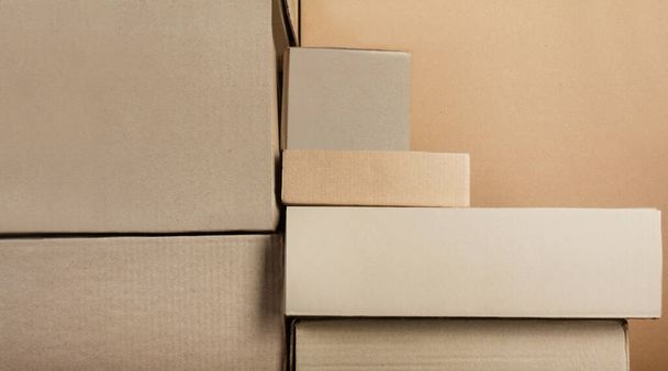 Backdrop photo of cardboard boxes stacked together. - Photo, Image