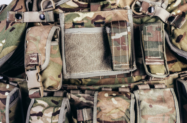 Close-up photo of multi camouflaged soldier vest pouches system.. - Photo, Image