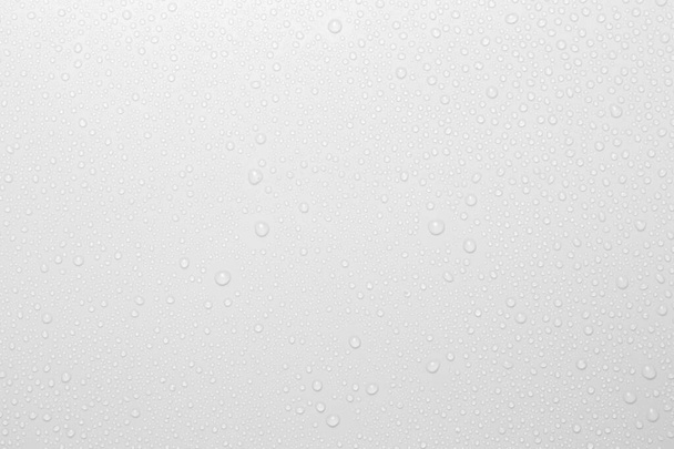 Gocce d'acqua su sfondo bianco, vista dall'alto - Foto, immagini