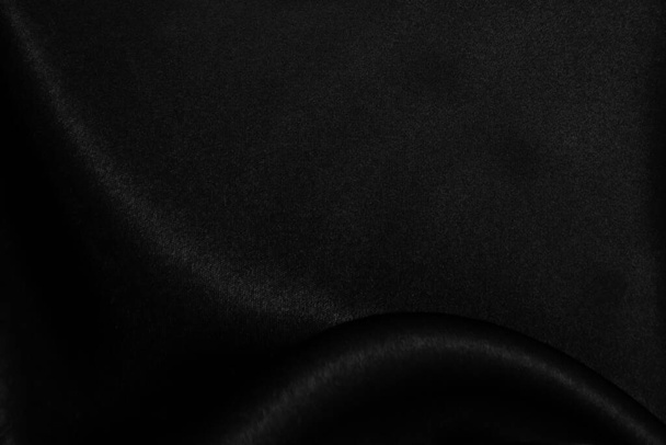 Гладка елегантна чорна шовкова або атласна текстура може використовуватись як абстрактний фон
 - Фото, зображення