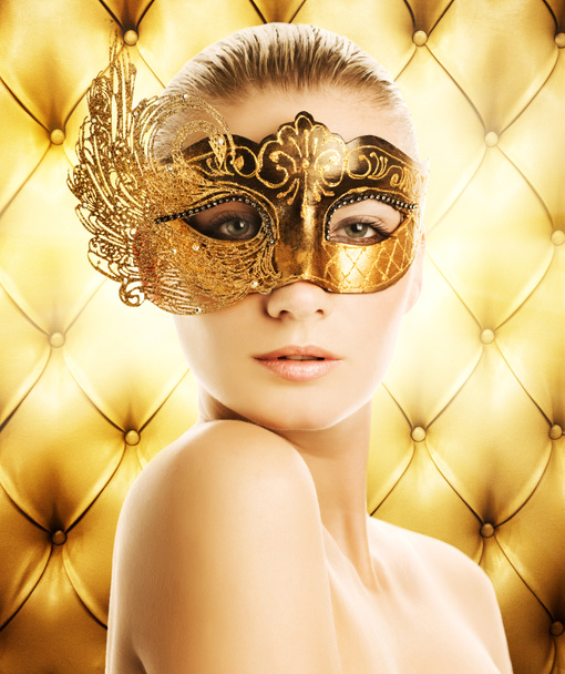 Beautiful woman in carnival mask over abstract background - Fotografie, Obrázek