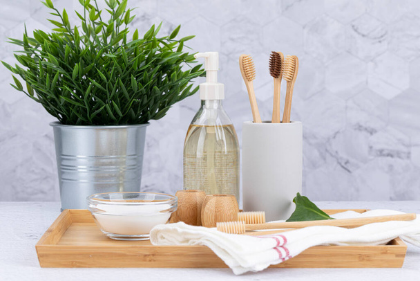 Zero waste - Bamboo toothbrush, baking soda, body oil, potted plant - Foto, immagini