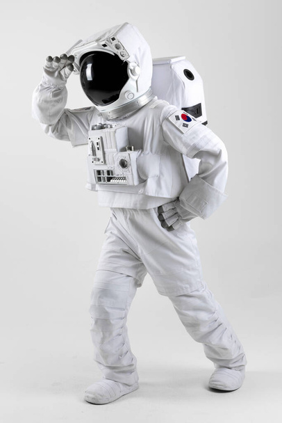 Astronaut staring away, white background - Foto, imagen