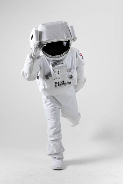 running astronaut, white background - Valokuva, kuva
