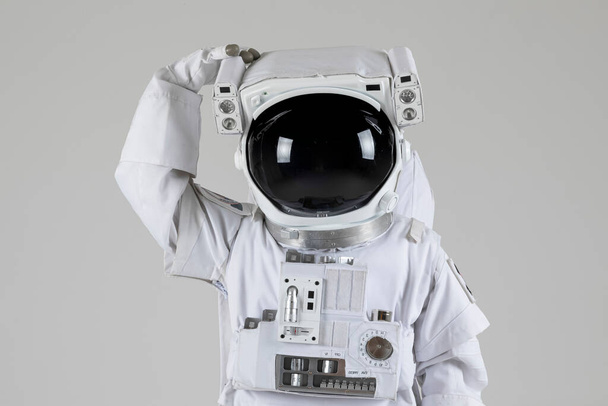 astronaut scratching head, white background - Foto, Imagem