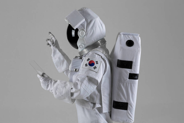 Astronaut, white backgrounds, astronauts are using tablet pc - Fotó, kép