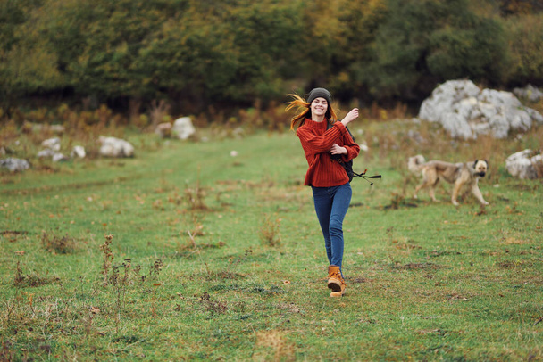 woman hiker with backpack walking in the field travel mountains fun - Φωτογραφία, εικόνα