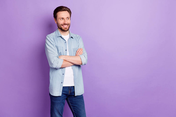 Photo of happy smiling positive confident businessman look copyspace with folded hands isolated on violet color background - Fotó, kép