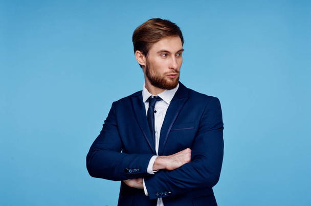 handsome man in suit self-confidence official blue background - Photo, Image