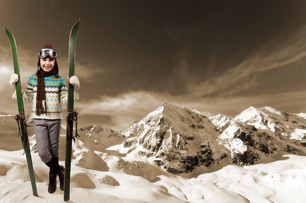 Skiing, winter vacation - girl with retro ski equipment - Photo, Image
