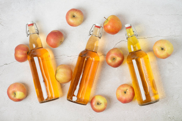 Bottles of apple cider vinegar. gray background top view space for text - Photo, Image